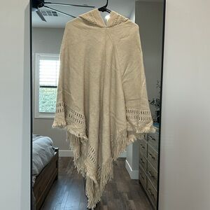 Poncho style sweater with hood
